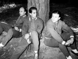 Veteran soccer star, Hungarian-born Ferenc Puskas, right, talks with an unidentified team-mate as they relax under a tree with another Spanish veteran Alfredo Di Stefano at the Spanish team's Football World Cup training camp near Vina Del Mar, Chile, on May 29, 1962. (AP Photo)